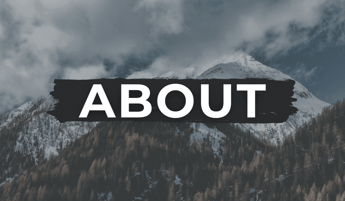 snowcapped mountains and trees with the word "ABOUT" written in white across the photo