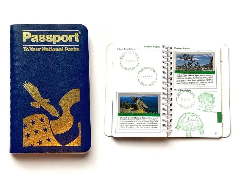 dark blue spiral passport book with stamps- national park store passport